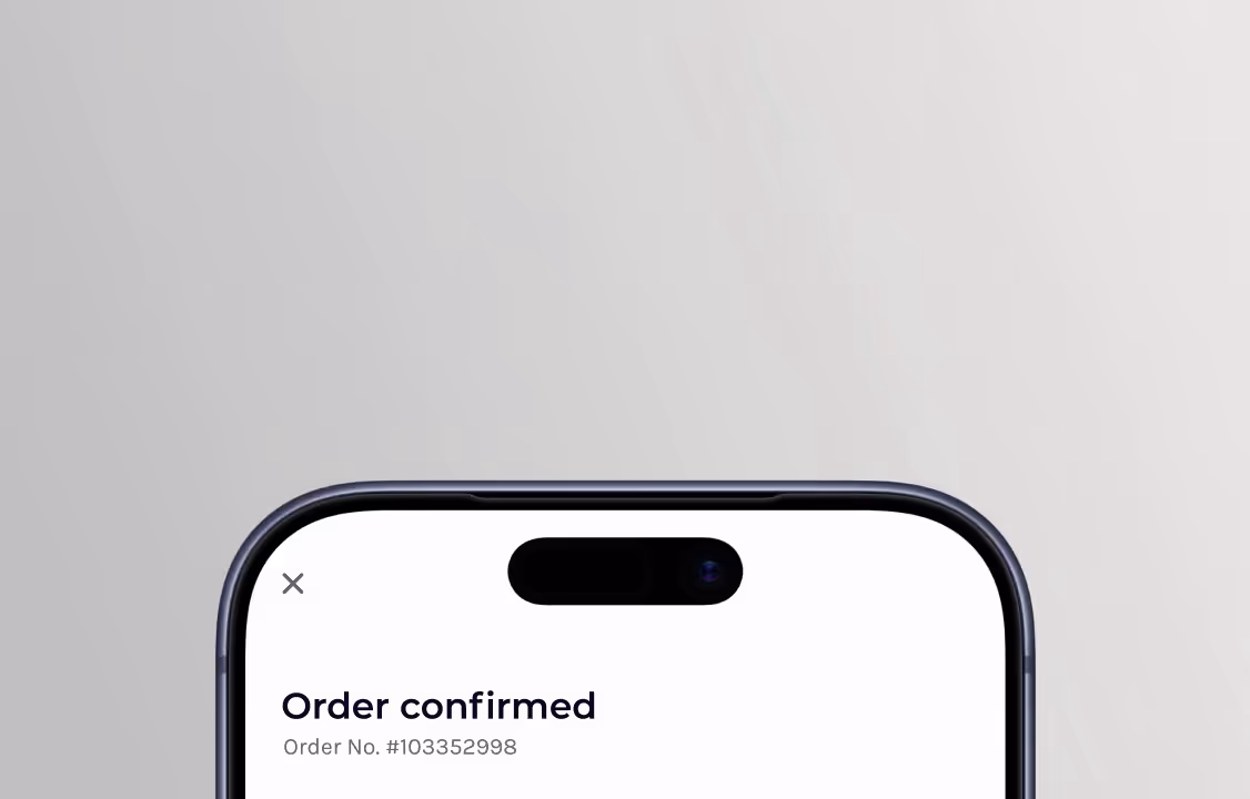 Top part of a smartphone screen showing 'Order confirmed' and order number #103352998.