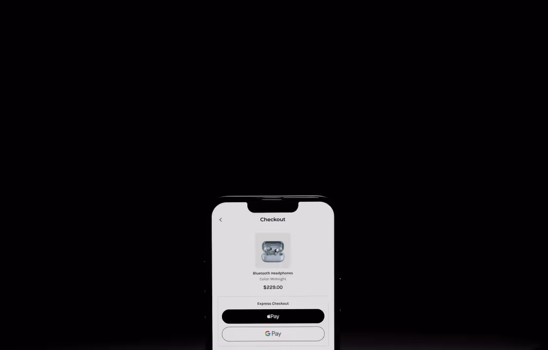 Smartphone screen showing checkout for Bluetooth headphones priced at $229 with Apple Pay and Google Pay options.